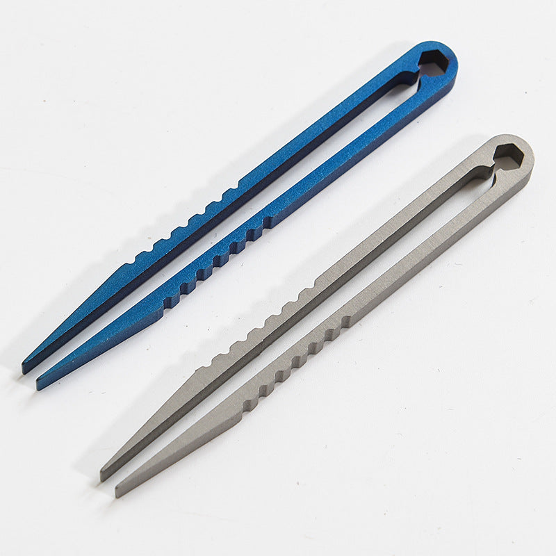 A pair of titanium clip tweezers with blue and gray handles shown diagonally on a white background.