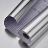 Roll of silver aluminum foil wall decals showing a grid pattern and measurement markings