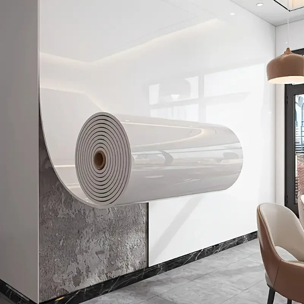 A roll of white marble imitation self-adhesive wall stickers mounted on a white wall.