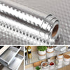 Roll of self-adhesive aluminum foil wall decals shown next to a metal storage rack.