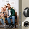 A family stands next to a smart deadbolt door lock and a traditional door lock on a wall.