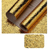 Rolls of self-adhesive aluminum foil wall decals showing a gold textured pattern.