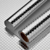 Roll of self-adhesive aluminum foil wall decals with a textured, reflective surface.