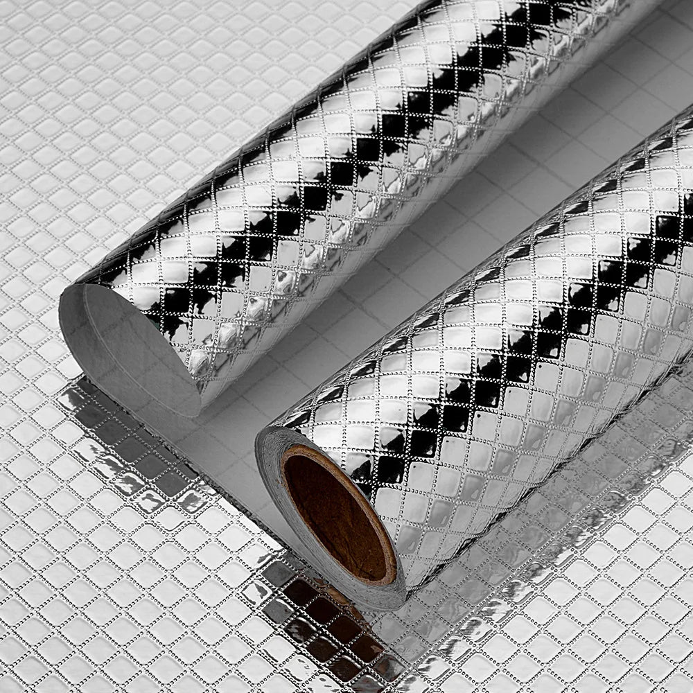 Roll of self-adhesive aluminum foil wall decals with a textured, reflective surface.