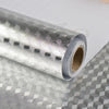 Roll of silver self-adhesive aluminum foil contact sheets with a geometric pattern