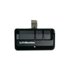 Black LiftMaster garage door remote control transmitter with a silver mounting piece.