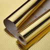 Roll of self-adhesive aluminum foil wall decals showing a textured surface and a rolled edge.