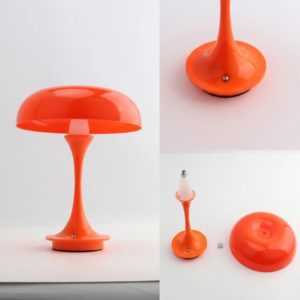 Lámpara de escritorio naranja con pantalla abovedada suave y soporte esbelto cónico.