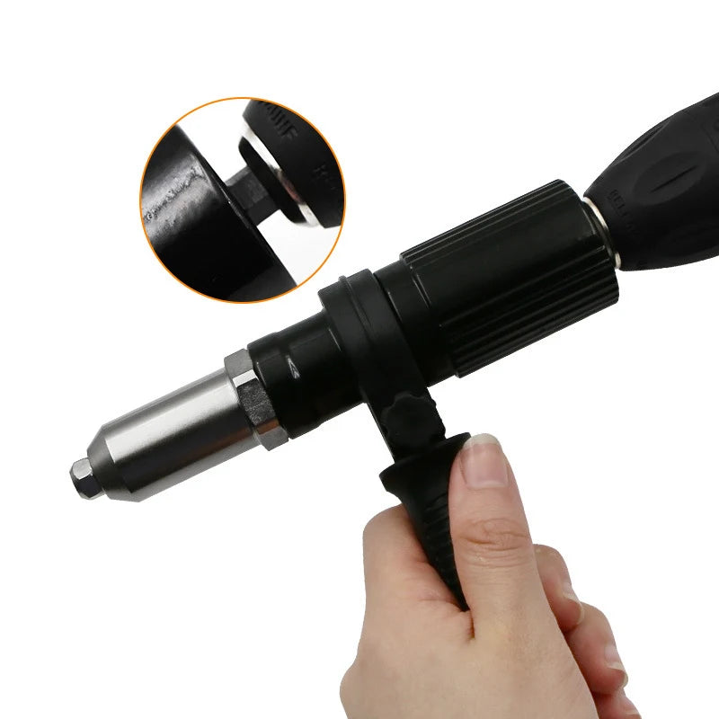 A hand holds a black professional electric rivet nut gun, showing the tip and an inset of the tool's mechanism.