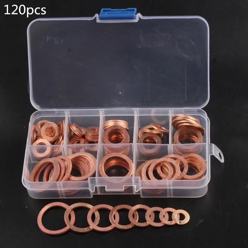A clear plastic box containing 120 copper sealing washers and sump plugs, with extra washers laid out below.