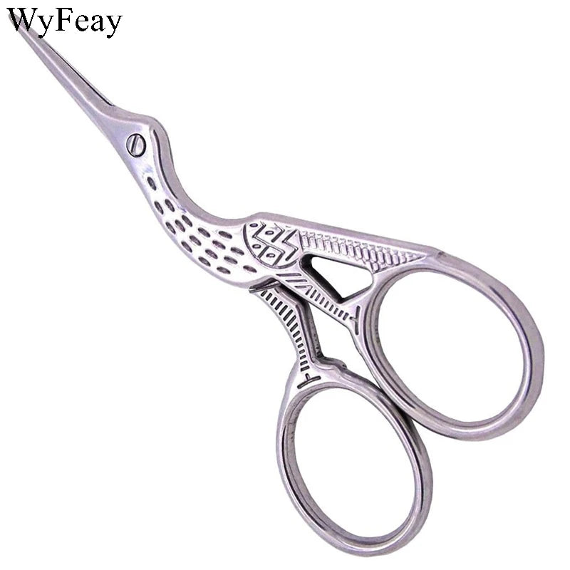 Silver vintage tailor scissors with floral embroidery pattern