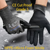 A hand wearing black CE Cut Proof Grade 5 gloves is shown cutting a material.