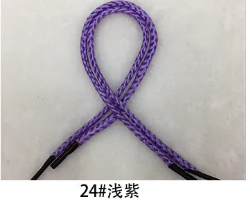 A purple braided rope used for gift wrapping, shown in an 'X' shape.