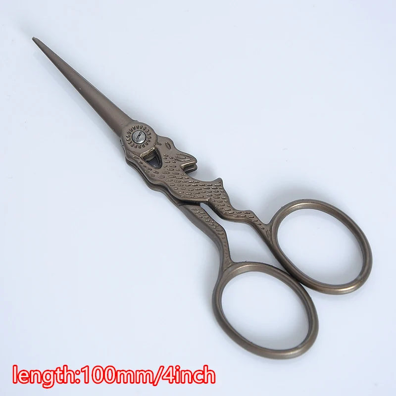 Vintage floral embroidery tailor scissors with a pointed blade and oval handles