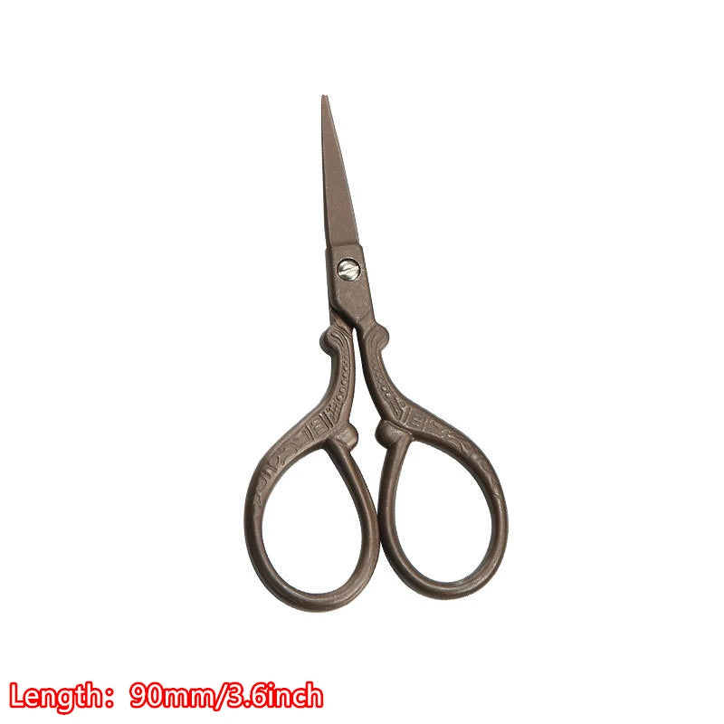 Vintage floral embroidery tailor scissors with a pointed blade and curved handles