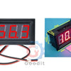 A black digital voltmeter gauge with red display and wires shown next to a small pink object.