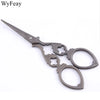 Vintage floral embroidery tailor scissors with a pointed blade and decorative handles