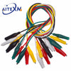 A bundle of precision alligator clips for electrical testing in various colors including red, yellow, green, and black.