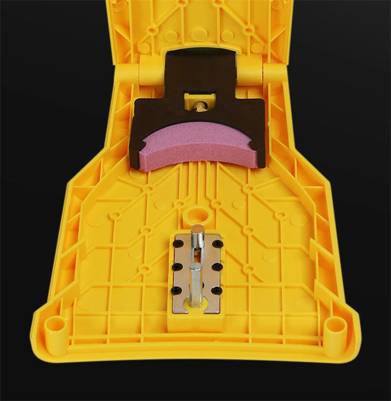 A yellow portable chainsaw tooth sharpening kit with a black sharpening block and metal inserts.