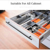 A close-up view of a stainless steel cabinet insert with various silverware and utensils organized in compartments.