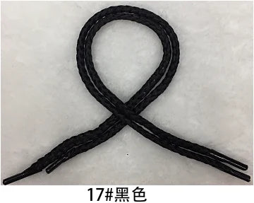 Black gift wrapping rope tied in an 'X' shape.