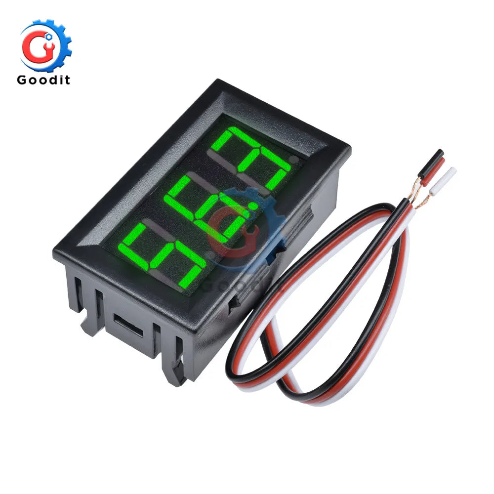 A black digital DC voltmeter gauge with green display and wires for automotive testing.