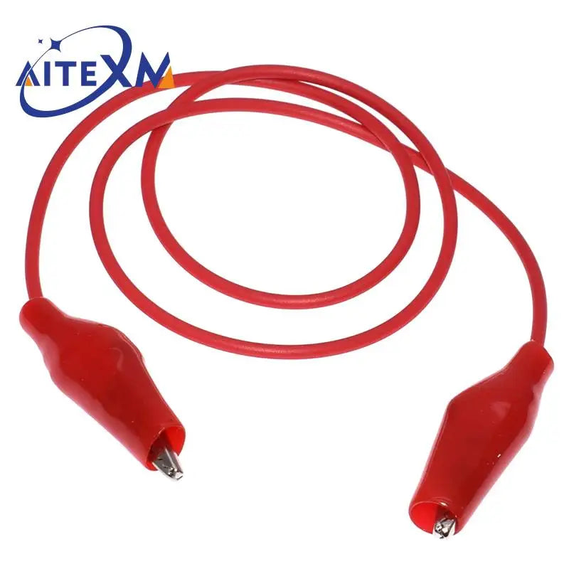 Red precision alligator clips for electrical testing, coiled and ready for use.
