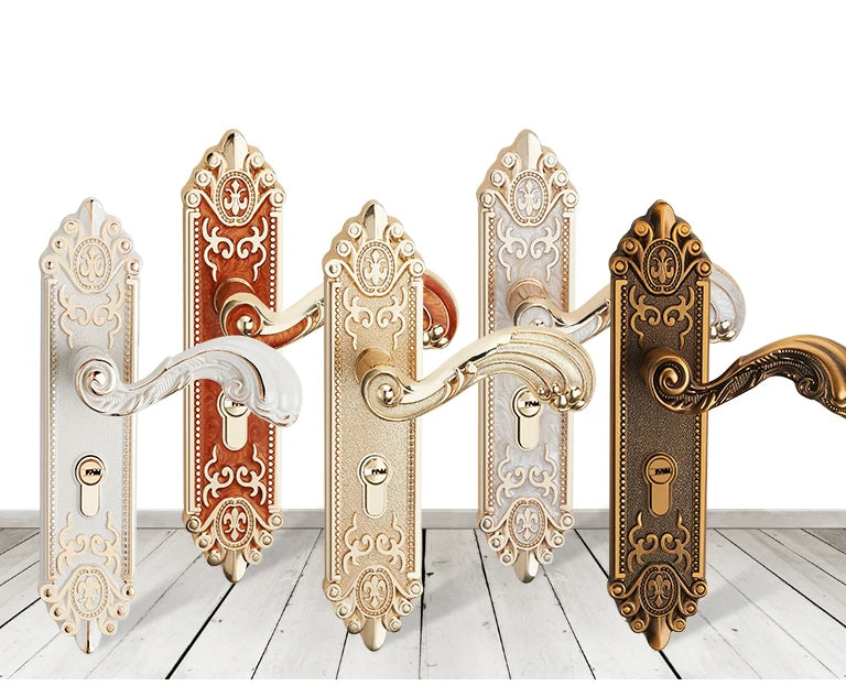 A set of ornate European style gold door locks with keys displayed against a white background.