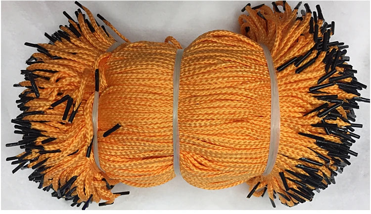 A spool of multi-color polypropylene gift wrapping rope with black fibers, shown from above.