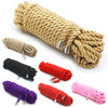 A collection of silky bondage ropes in various colors including beige, black, red, purple, and pink.