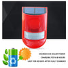 A red solar motion sensor security alarm device with a solar panel and lens is shown against a black background.