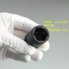 A hand wearing a white glove holds a black socket with an inner circular design and a protect nut.