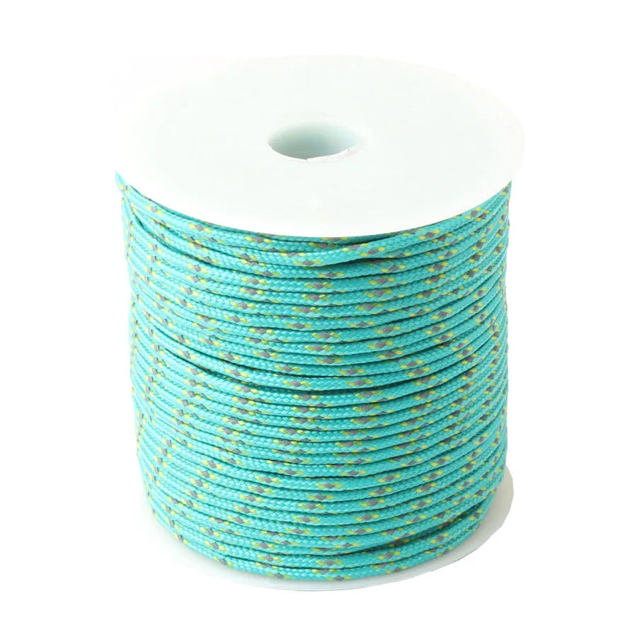 A spool of bright turquoise reflective paracord rope coiled on a white background.