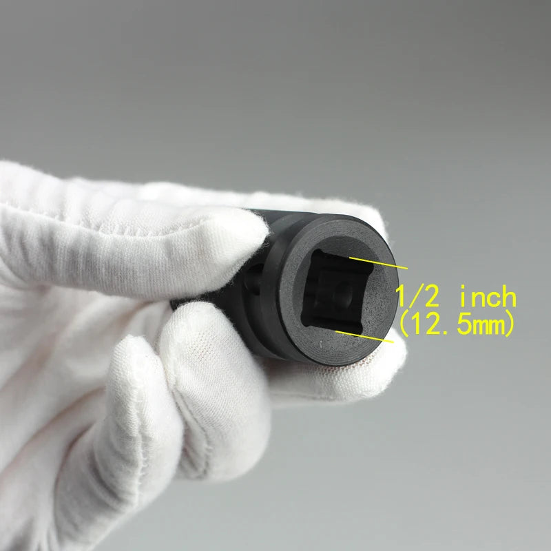 A hand in a white glove holds a black point impact socket, showing its size as 1/2 inch or 12.5mm.