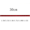 A red aluminum triangular ruler marked in centimeters, showing various scale divisions.