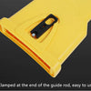 Yellow portable chainsaw tooth sharpening kit clamped at the end of a guide rod