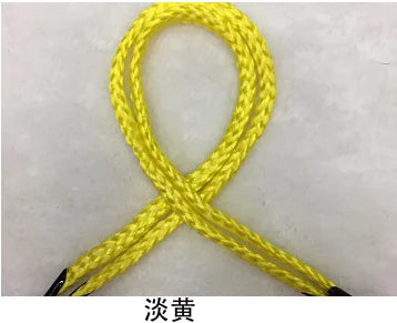 A yellow gift wrapping rope tied in an 'X' shape.
