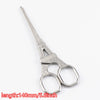 Silver vintage tailor scissors with floral embroidery pattern and oval handles