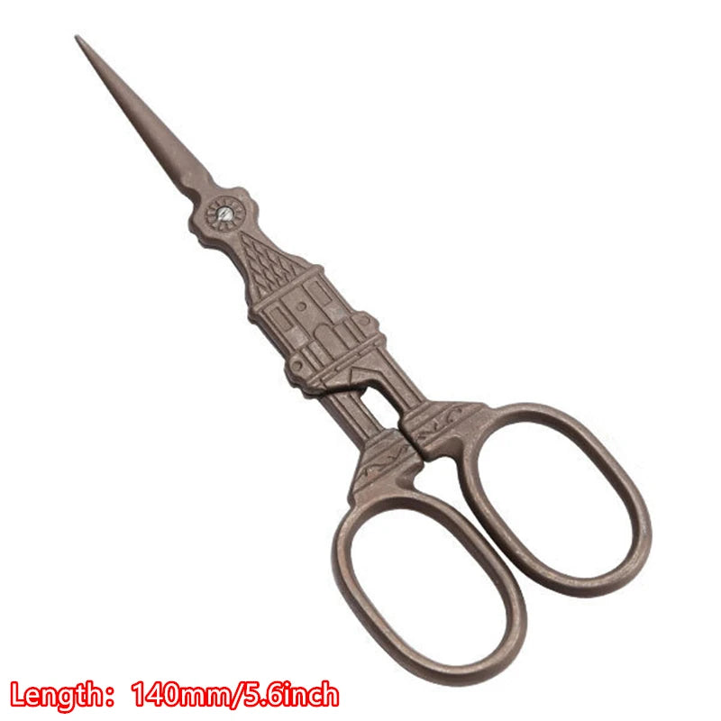 Vintage floral embroidery tailor scissors with a pointed blade and antique metal handles