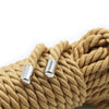 A close-up of a thick, golden beige silky bondage rope set with silver metal ends.