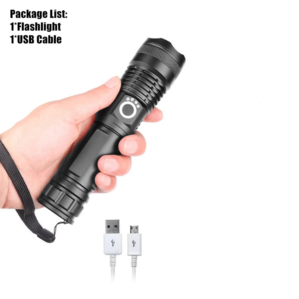 A hand holds a black tactical rechargeable LED flashlight and an accompanying USB cable.