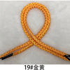 A piece of 19# gold thread or rope, orange in color, tied into a figure-eight shape.