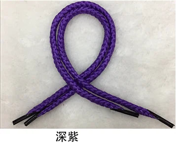 A purple gift wrapping rope tied in a bow shape.