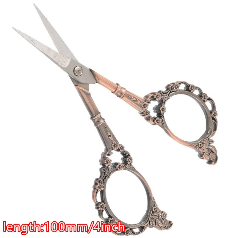 Vintage floral embroidery tailor scissors with ornate handles and silver blades