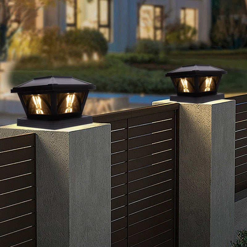 Outdoor solar LED post cap lights mounted on a textured wall with horizontal slats.