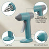 A teal cordless hot glue gun with a large base and silicone nozzle guard shown with various components.
