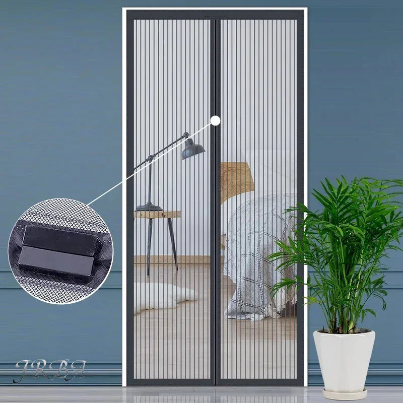 A pair of black magnetic mesh mosquito curtains installed on a glass door, shown against a blue wall.