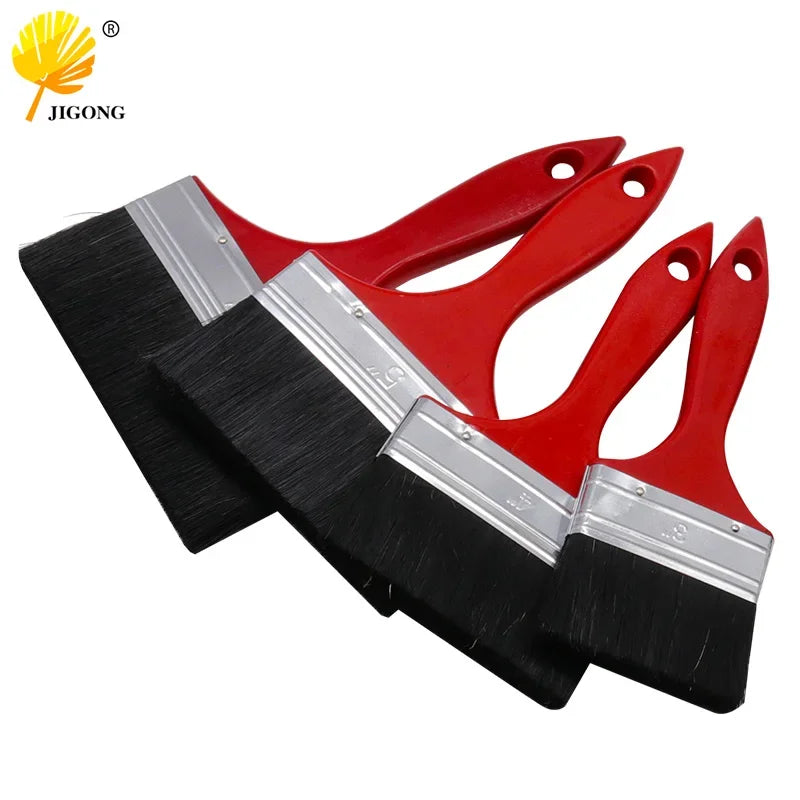 A set of five versatile red and black bristle paint brushes with silver metal blades.