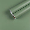 A roll of light green waterproof vinyl wall decals lying on a flat surface.