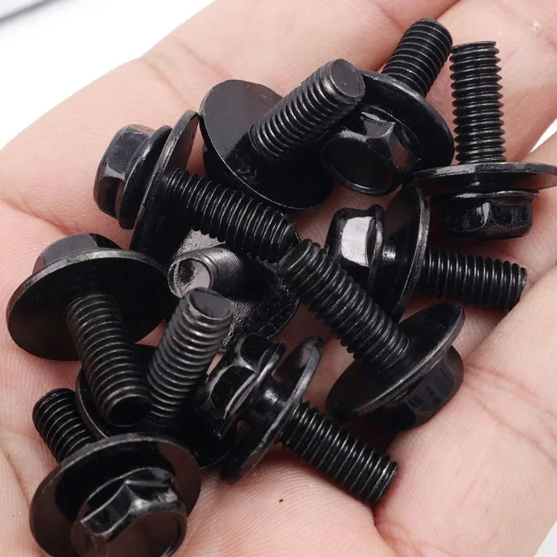 A hand holds several black U-type body bolts and clips for auto fastening.